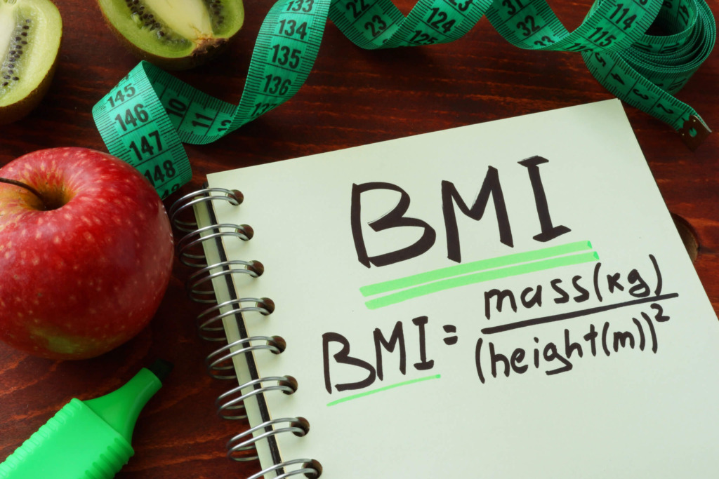 BMI body mass index  (metric formula) written on a notepad sheet